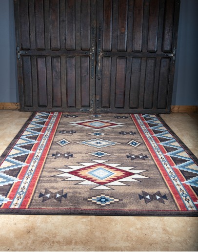 Navajo-inspired Bow Strings Brown Rug with red, blue, and light and dark brown patterns, made of UV fade, stain, and moisture-resistant EnduraStran nylon, American-made