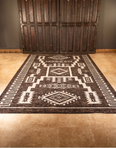 southwestern style rug with browns and cream colors