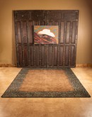rich chocolate brown and turquoise highlight tooled leather patterns on these premium nylon rugs, adding sophisticated western style to any room