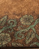 rich chocolate brown and turquoise highlight tooled leather patterns on these premium nylon rugs, adding sophisticated western style to any room