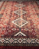 distressed southwestern style rug with dark reds