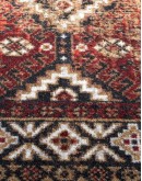 distressed southwestern style rug with dark reds