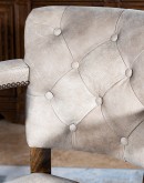 tufted leather swivel barstool with arms and ostrich leather on the outside