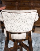 tufted leather swivel barstool with arms and ostrich leather on the outside