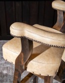 cream leather barstool with boot stitch design on back