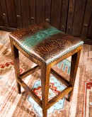 saddle stool with leather seat cushion