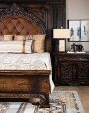 spanish style wood bed with tufted leather headboard