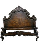 spanish style bed with carved wood
