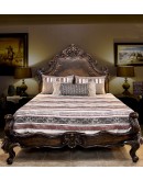 spanish style bed with carved wood