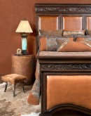 high end southwestern style bed with leather panels and carved wood