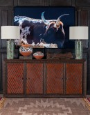 Gertie Longhorn Framed Art depicting a majestic longhorn on a textured black canvas, encased in a mat black wood frame, perfect for rustic home or office decor.