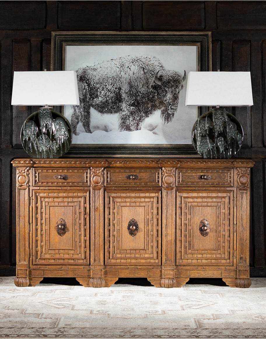 brown carved wood buffet with hand carvings