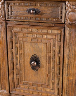 brown carved wood buffet with hand carvings