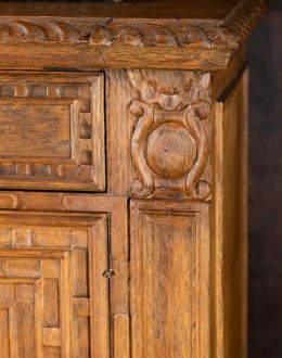 brown carved wood buffet with hand carvings
