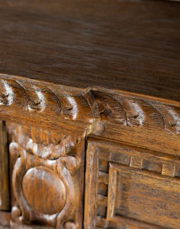 brown carved wood buffet with hand carvings