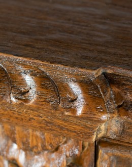 brown carved wood buffet with hand carvings