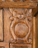 brown carved wood buffet with hand carvings