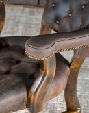 game chair with axis deer hide and brown tufted leather seat cushions