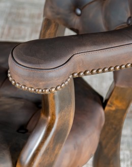 game chair with axis deer hide and brown tufted leather seat cushions