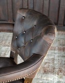 game chair with axis deer hide and brown tufted leather seat cushions