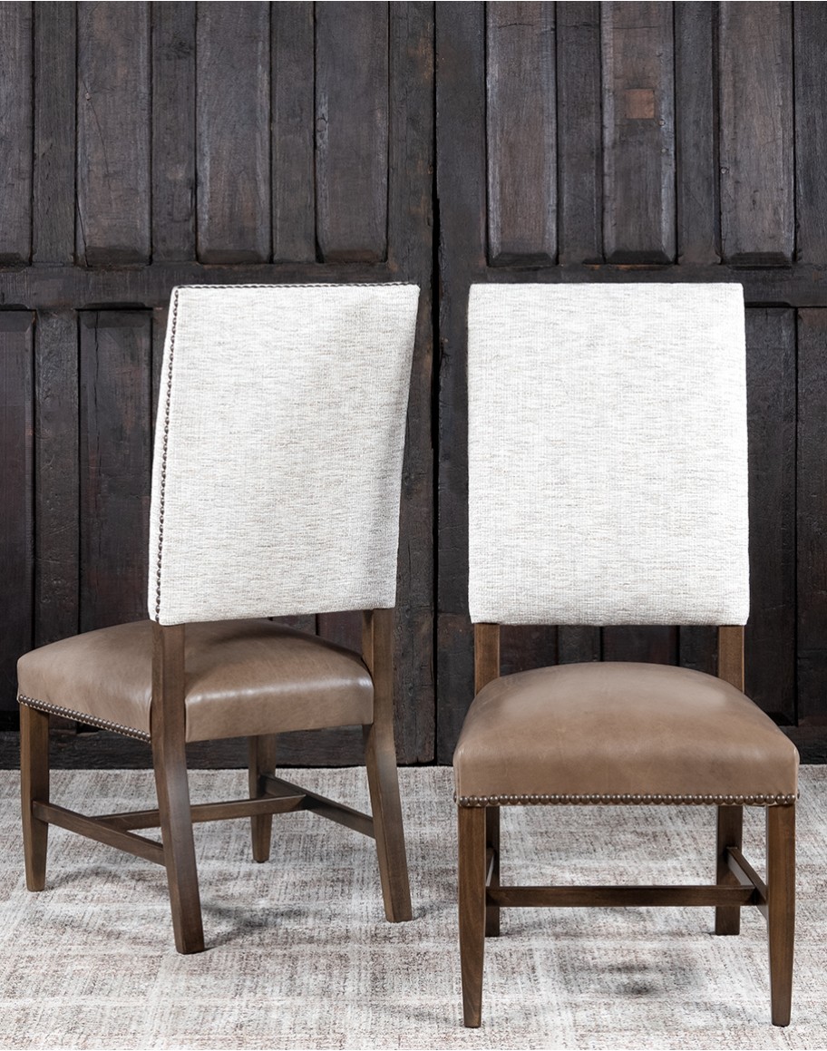 High End Dining Chair with a solid hardwood frame, full grain leather seat cushion, and tweed textured fabric on the inside and outside back, adorned with brass nail tacks.