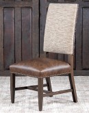 Dining Chair with a solid hardwood frame, top grain leather seat cushion, tweed textured fabric on the inside back, and floral-patterned stamped cowhide on the outer back, adorned with brass nail tacks.