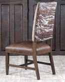 Dining Chair with a solid hardwood frame, top grain leather seat cushion, tweed textured fabric on the inside back, and floral-patterned stamped cowhide on the outer back, adorned with brass nail tacks.