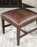 Dining Chair with a solid hardwood frame, top grain leather seat cushion, tweed textured fabric on the inside back, and floral-patterned stamped cowhide on the outer back, adorned with brass nail tacks.