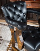 Tufted black leather seat and back cushions contrasted with upholstery grade Brindle cowhide on the outside back. Solid alderwood frame. Versatile and stylish for office, dining, or game rooms. 100% American made