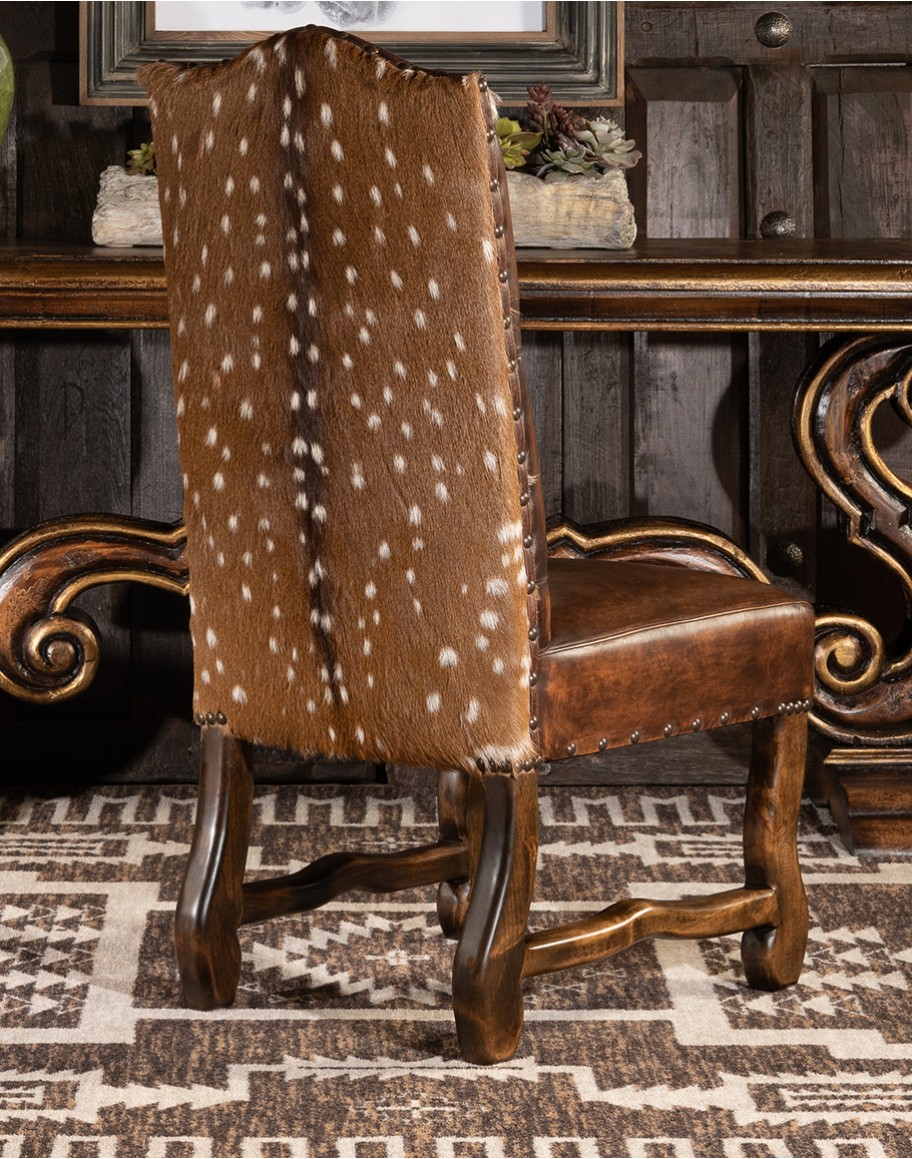 leather dining chair with a button tufted seat back and real axis deer hide