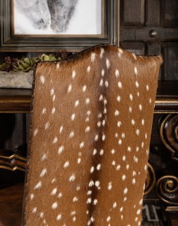 leather dining chair with a button tufted seat back and real axis deer hide