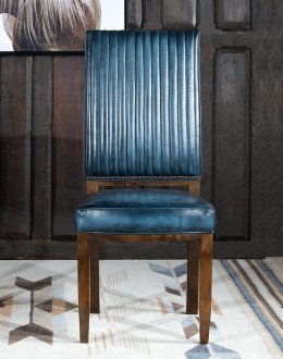 American-made Huckleberry Leather Dining Chair in blue top grain leather with hand-antiqued details, modern rustic frame, and unique hair-on-hide floral pattern on the back.