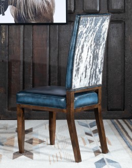 American-made Huckleberry Leather Dining Chair in blue top grain leather with hand-antiqued details, modern rustic frame, and unique hair-on-hide floral pattern on the back.