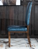 American-made Huckleberry Leather Dining Chair in blue top grain leather with hand-antiqued details, modern rustic frame, and unique hair-on-hide floral pattern on the back.