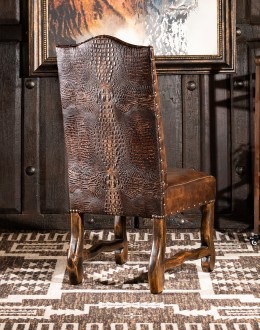 fine leather dining chair with a button tufted seat back and croc leather on back,chaps leather and croc back dining chair