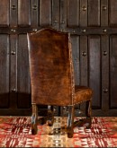 fine leather dining chair with a button tufted seat back