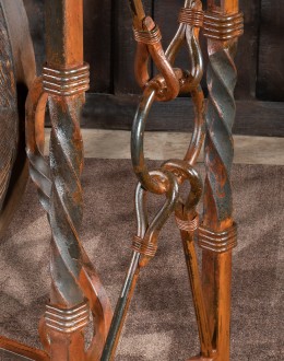 Western-style Pioneer Wagon Wheel Pub Table featuring a solid hand-forged iron base with a detailed wagon wheel design, finished in natural rust and sealed for durability. The top is crafted from distressed Chilean Pine, adding rustic elegance to the piec