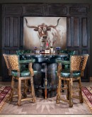 Experience the fusion of American heritage and old Western charm with the Rifleman Barrel Pub Table. Crafted from an authentic whiskey barrel and adorned with .22 caliber replica rifles, this saloon-style table seats four and adds a unique, rustic eleganc