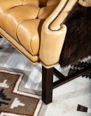 large wingback chair with buffalo hair on back