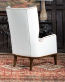 cream leather accent chair with exposed wood frame and contrasting welts