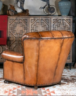 American-made Author Tufted Leather Chair by Remington Tanners, featuring full-grain leather, 8-way hand-tied construction, and deep button tufts, perfect for elegant interiors.