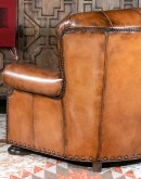 American-made Author Tufted Leather Chair by Remington Tanners, featuring full-grain leather, 8-way hand-tied construction, and deep button tufts, perfect for elegant interiors.
