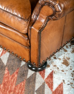 American-made Author Tufted Leather Chair by Remington Tanners, featuring full-grain leather, 8-way hand-tied construction, and deep button tufts, perfect for elegant interiors.