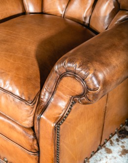 American-made Author Tufted Leather Chair by Remington Tanners, featuring full-grain leather, 8-way hand-tied construction, and deep button tufts, perfect for elegant interiors.