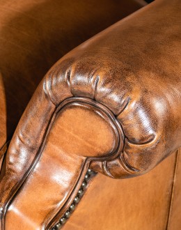 American-made Author Tufted Leather Chair by Remington Tanners, featuring full-grain leather, 8-way hand-tied construction, and deep button tufts, perfect for elegant interiors.