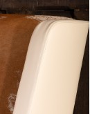 cream leather accent chair with exposed wood frame and cowhide 