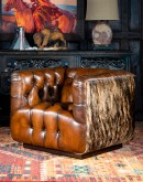 tufted leather club chair with antiqued leather and brindle cowhide on the outside