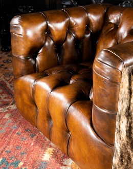 Beretta Club Chair tufted leather club chair with antiqued leather and brindle cowhide on the outside