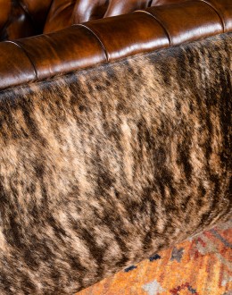 Beretta Club Chair tufted leather club chair with antiqued leather and brindle cowhide on the outside