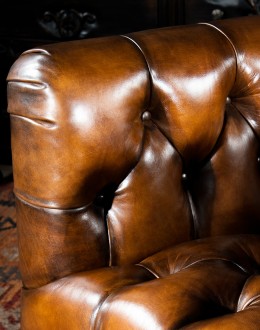 Beretta Club Chair tufted leather club chair with antiqued leather and brindle cowhide on the outside